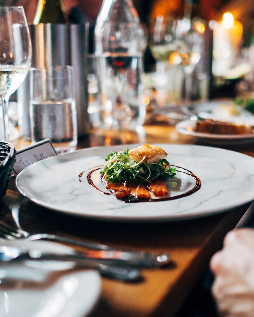 Intimate dining table with stone plates and glassware